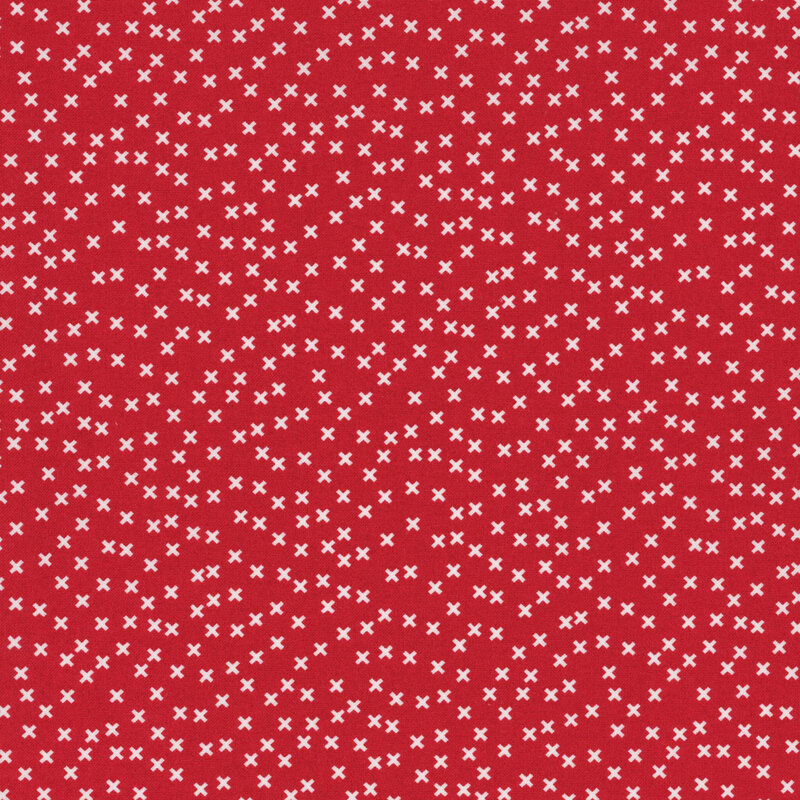 red fabric featuring a scattered white x pattern