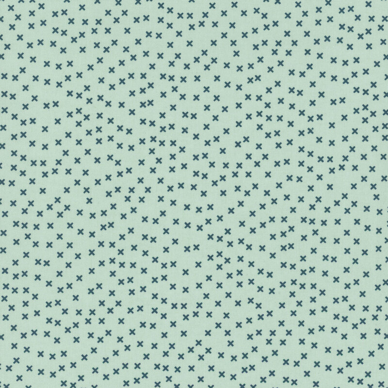 aqua fabric featuring a scattered navy blue x pattern