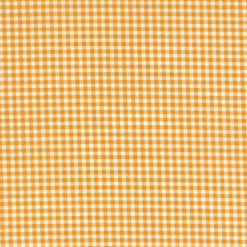 mustard yellow gingham fabric featuring diagonally dashed connecting squares