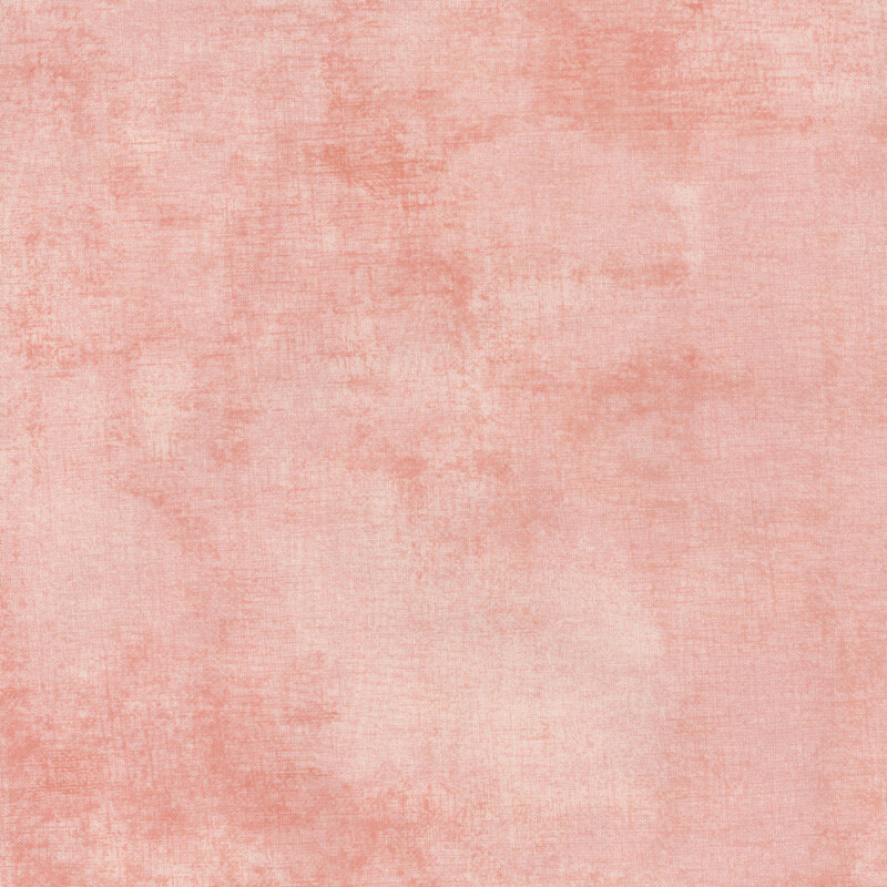 fabric with a beautiful peach pink dry brush texture on a pastel pink background