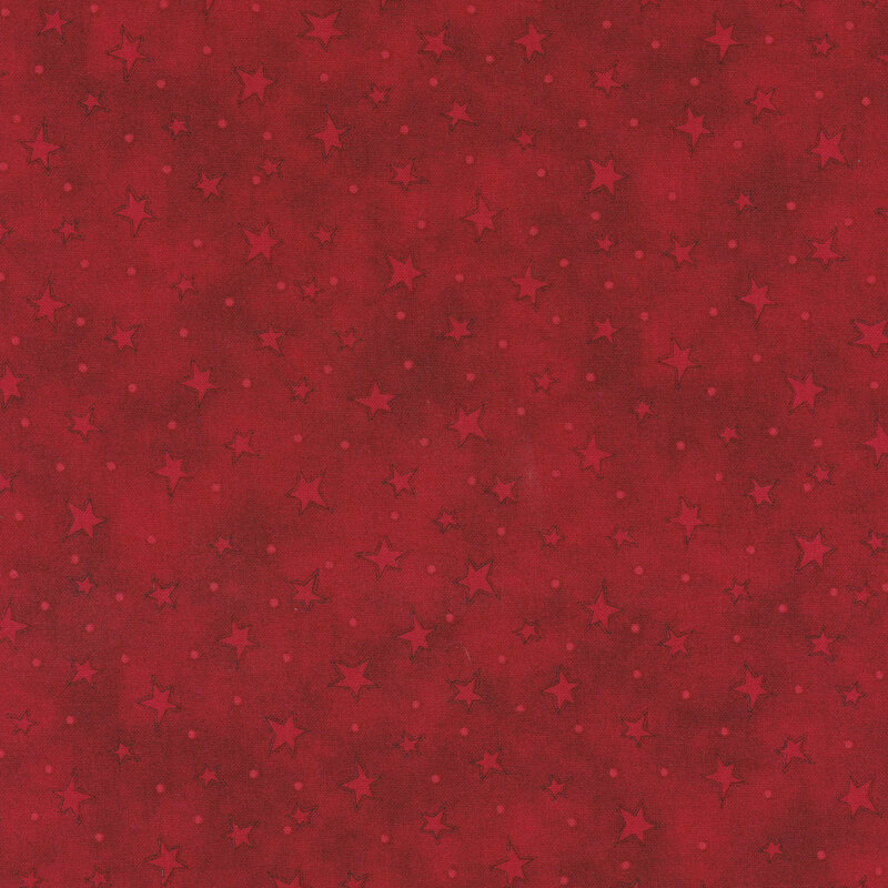 mottled red fabric with scattered ditsy stars and tonal speckles