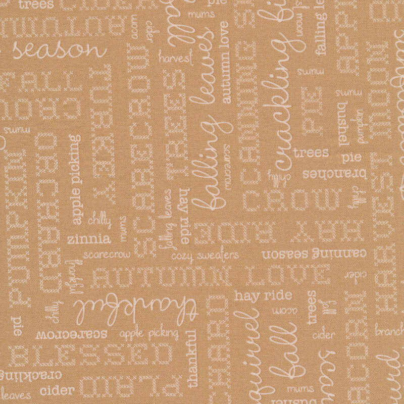 beige fabric featuring cream words in different fonts pertaining to autumn