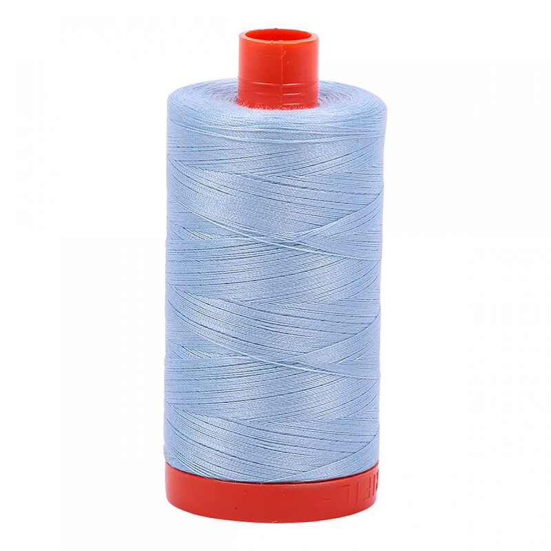 A spool of Aurifil 2710 - Light Robins Egg thread on a white background