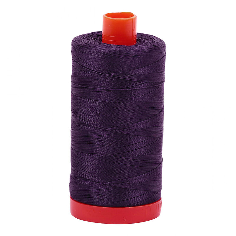 A spool of Aurifil 2581 -Dark Dusty Grape thread on a white background