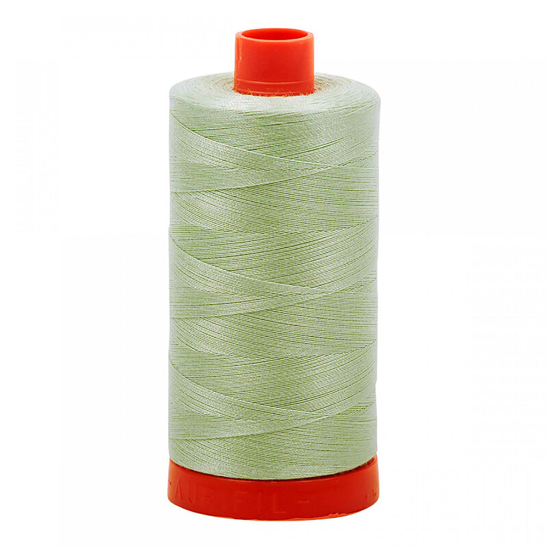 A spool of Aurifil 2912 - Platinum thread on a white background