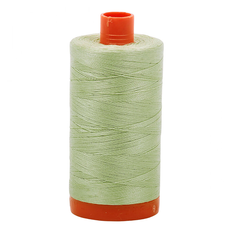 A spool of Aurifil 2908 - Spearmint thread on a white background