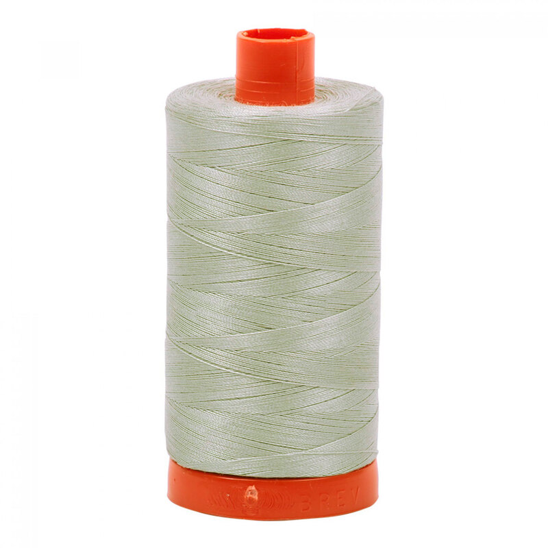 A spool of Aurifil 6726 - Airstream thread on a white background