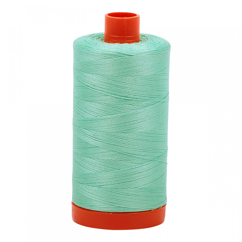 A spool of Aurifil 2835 -Medium Mint thread on a white background