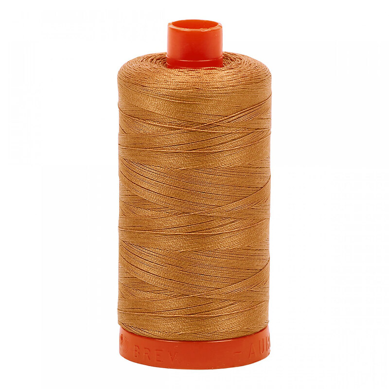 A spool of Aurifil 2330 -Light Chestnut thread on a white background