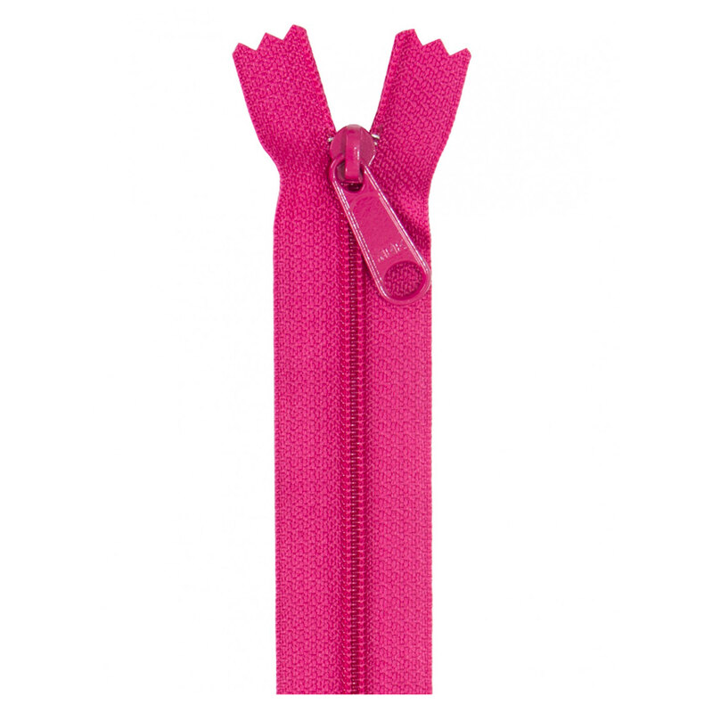 Photo of a hot pink zipper isolated on a white background