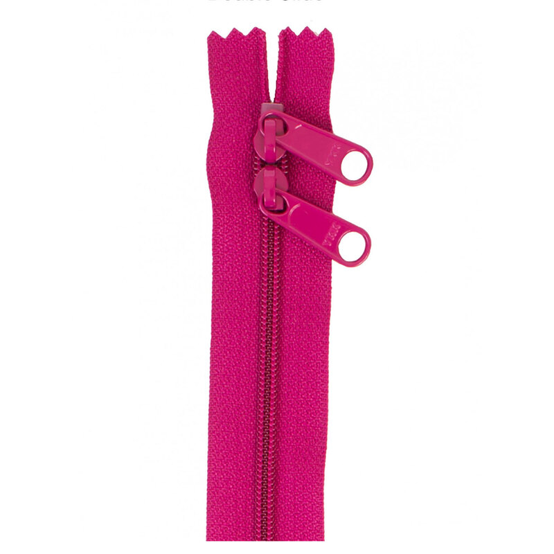 Photo of a bright pink zipper with two pull tabs isolated on a white background