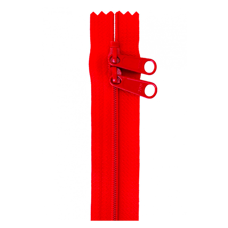 Photo of a red zipper isolated on a white background