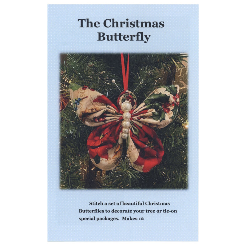 Front cover of the Christmas Butterfly ornament pattern with a blue cover and a christmas themed butterfly ornament hung from a Christmas tree on it