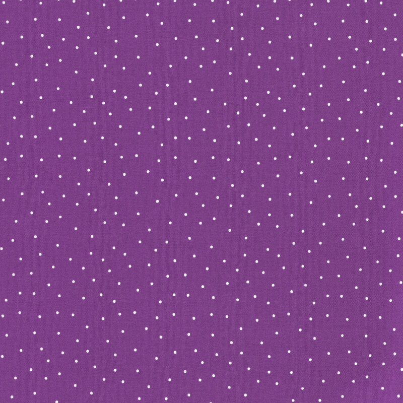 fabric featuring a purple background with scattered small white dots