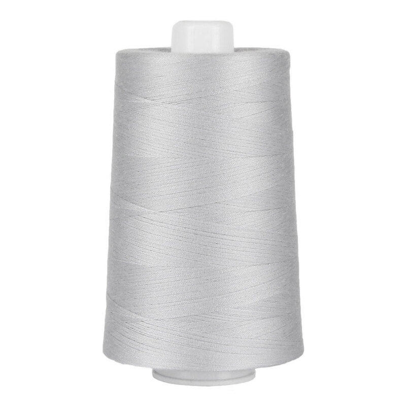 Large spool of light gray thread on a white background