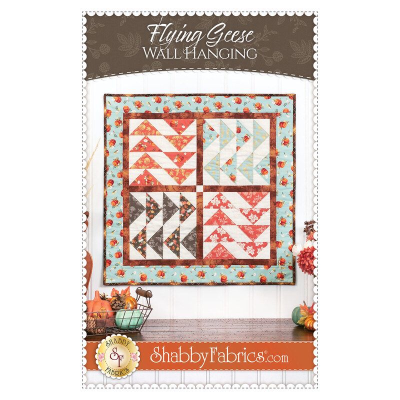 Photo of the wall hanging pattern booklet front showing the finished product, title, and designer info
