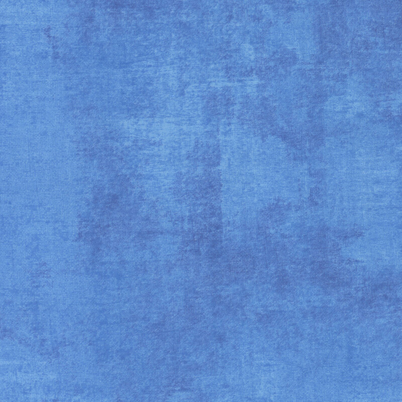 vibrant blue fabric featuring denim blue dry-brushed texturing