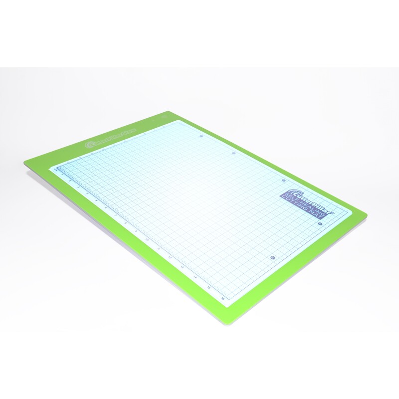 Green cutting mat with a grid pattern, used for crafting and precision cutting.