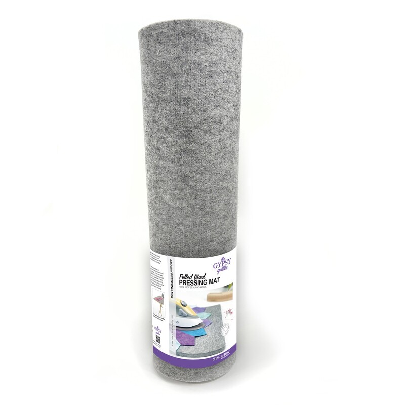 Rolled gray pressing mat with packaging displaying product information and usage instructions.