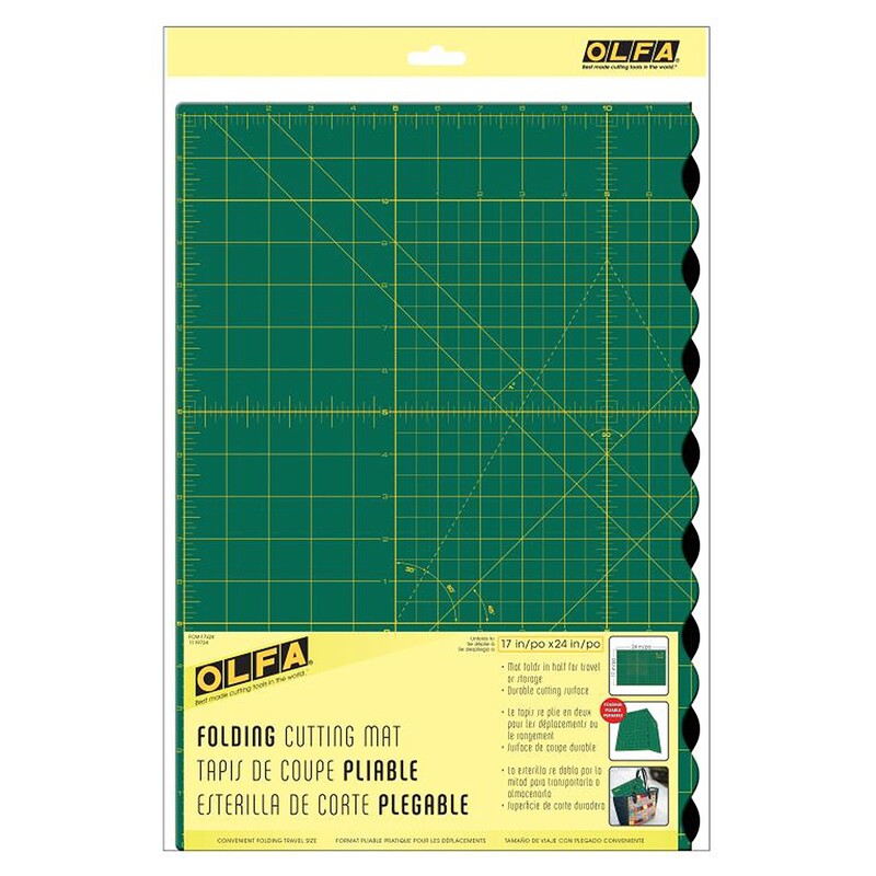 Green folding cutting mat with grid lines and markings, packaged with a yellow label, by OLFA.