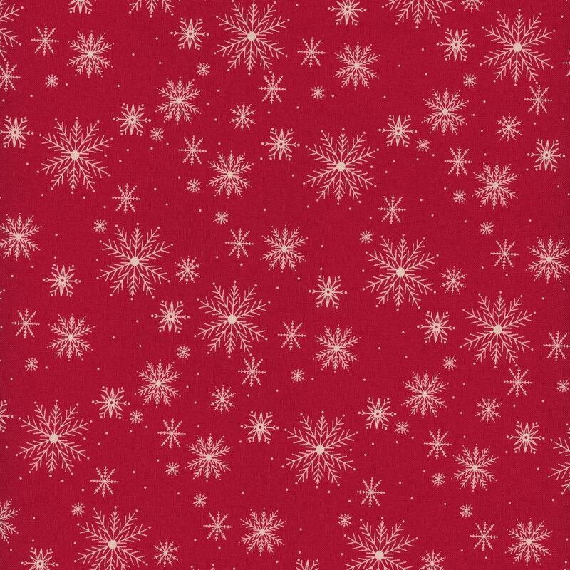 Red fabric with pale white snowflakes in varying sizes