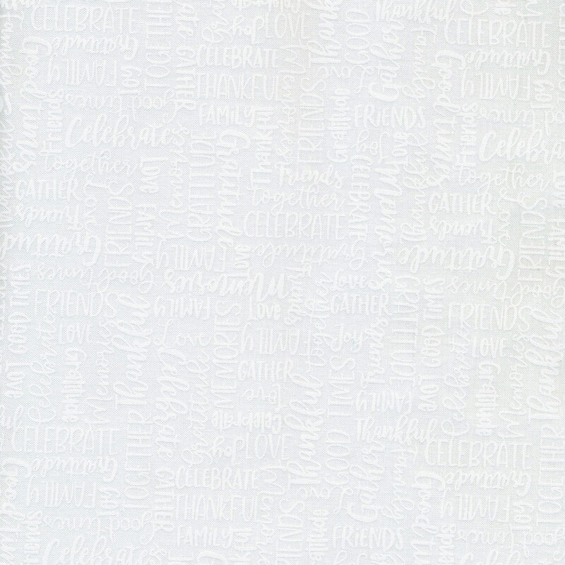 White words of celebration on white fabric.