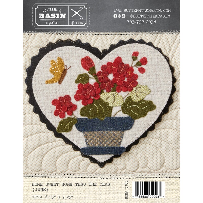 Front of pattern with finished heart featuring a woolen flowers in a pot with a visiting butterfly friend