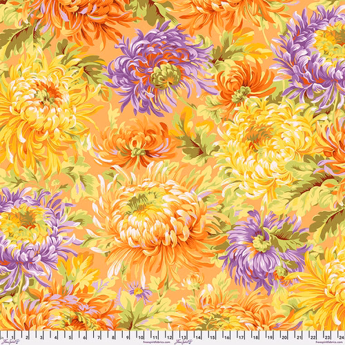 Fabric featuring vibrant yellow, orange, and purple chrysanthemums over a light orange background