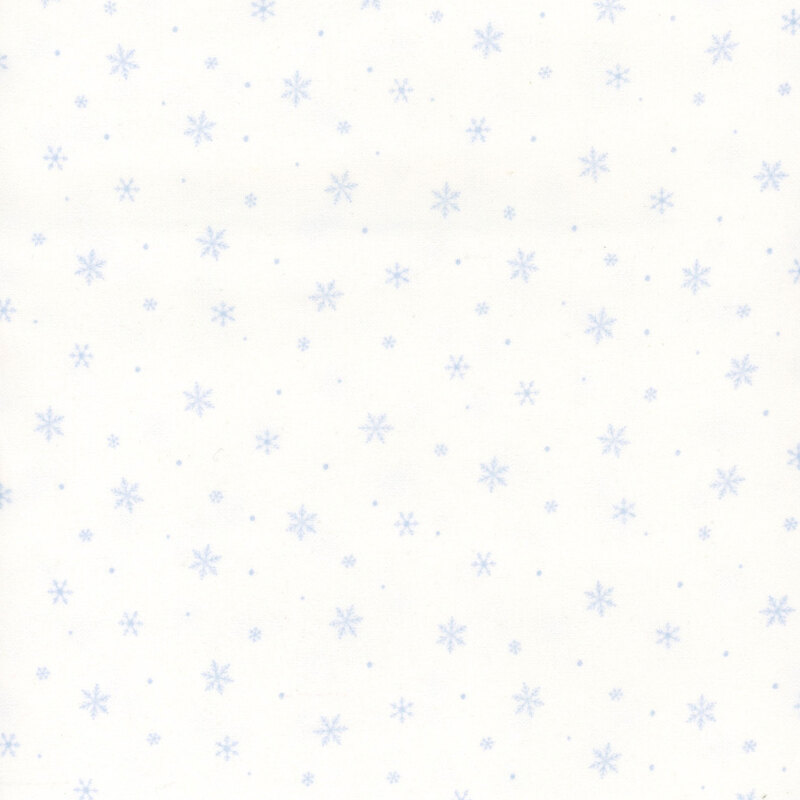 Small pastel blue snowflakes on white fabric.