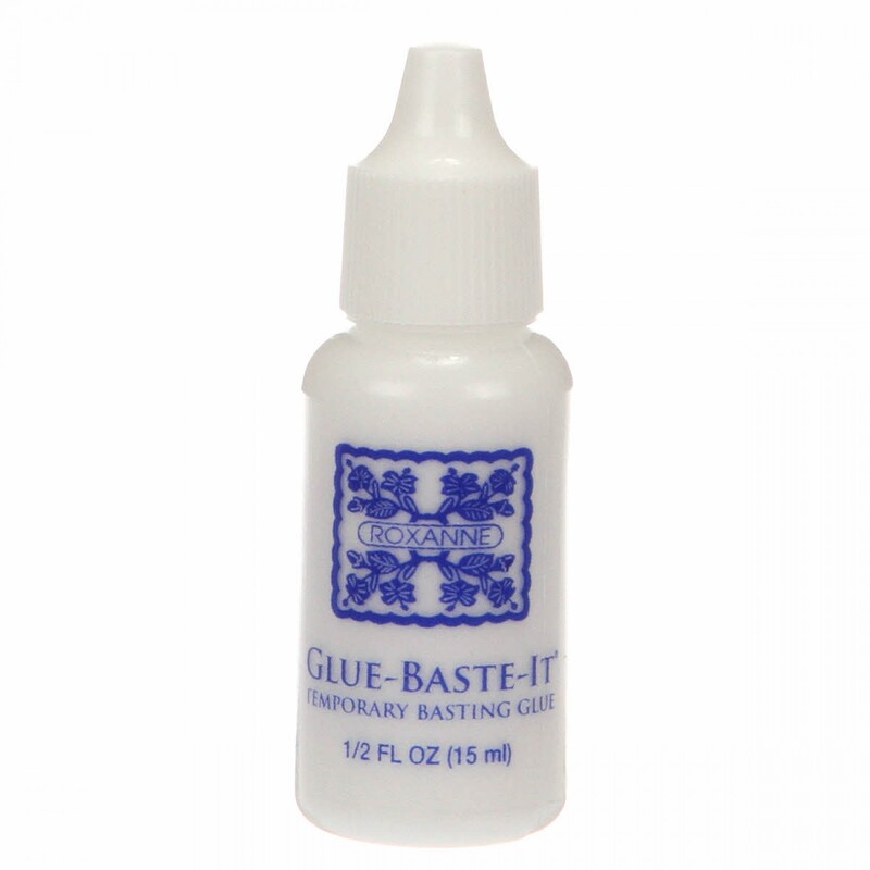 Bottle of Glue-Baste-It temporary basting glue, 0.5 fl oz, with a blue design on the label.