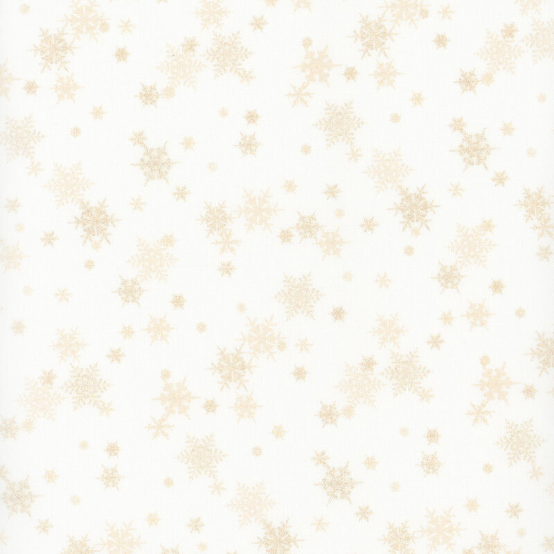 white fabric featuring small scattered cream snowflakes