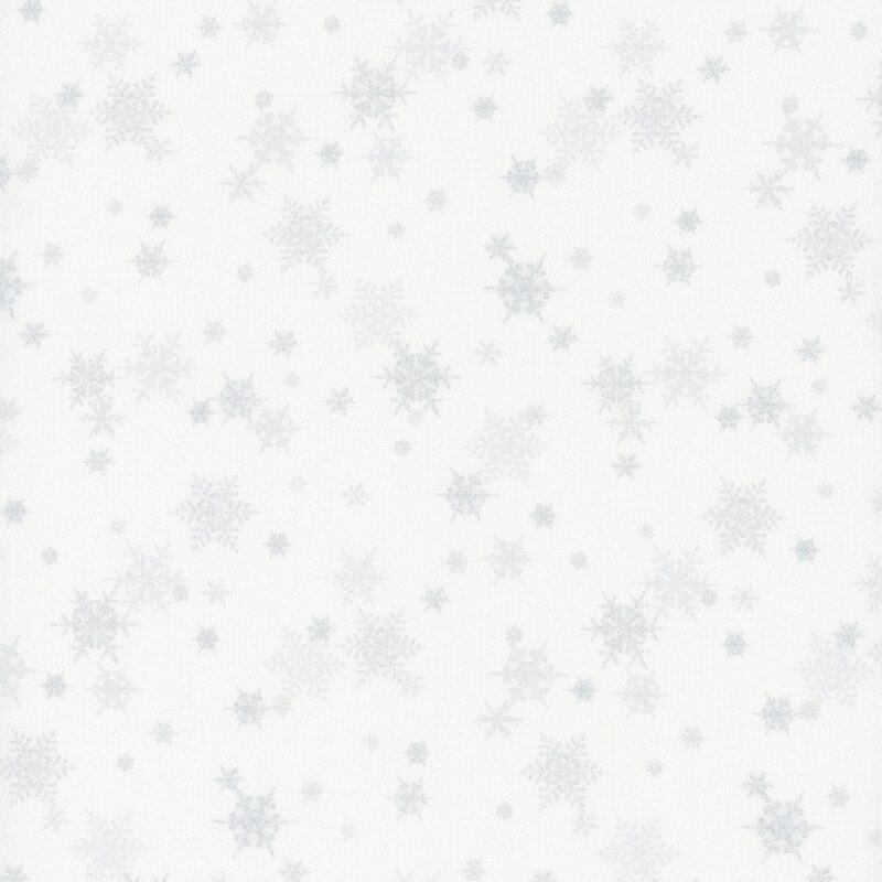 white fabric featuring small scattered light gray snowflakes