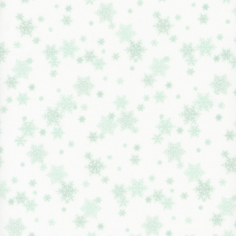 white fabric featuring small scattered mint green snowflakes