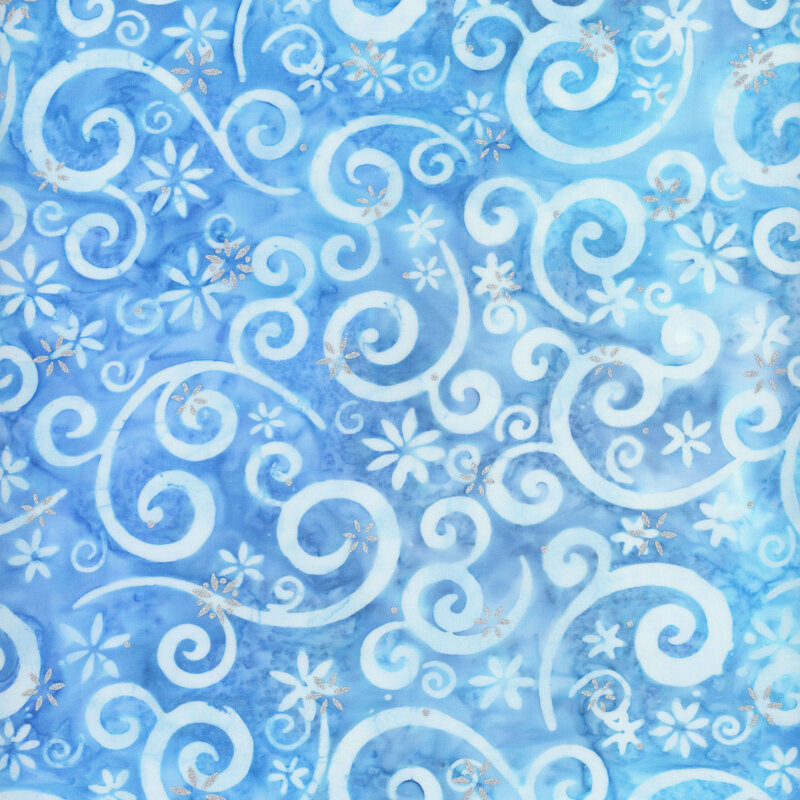 light blue mottled fabric featuring pastel blue swirling scrolls and snowflakes, accented with metallic silver snowflakes