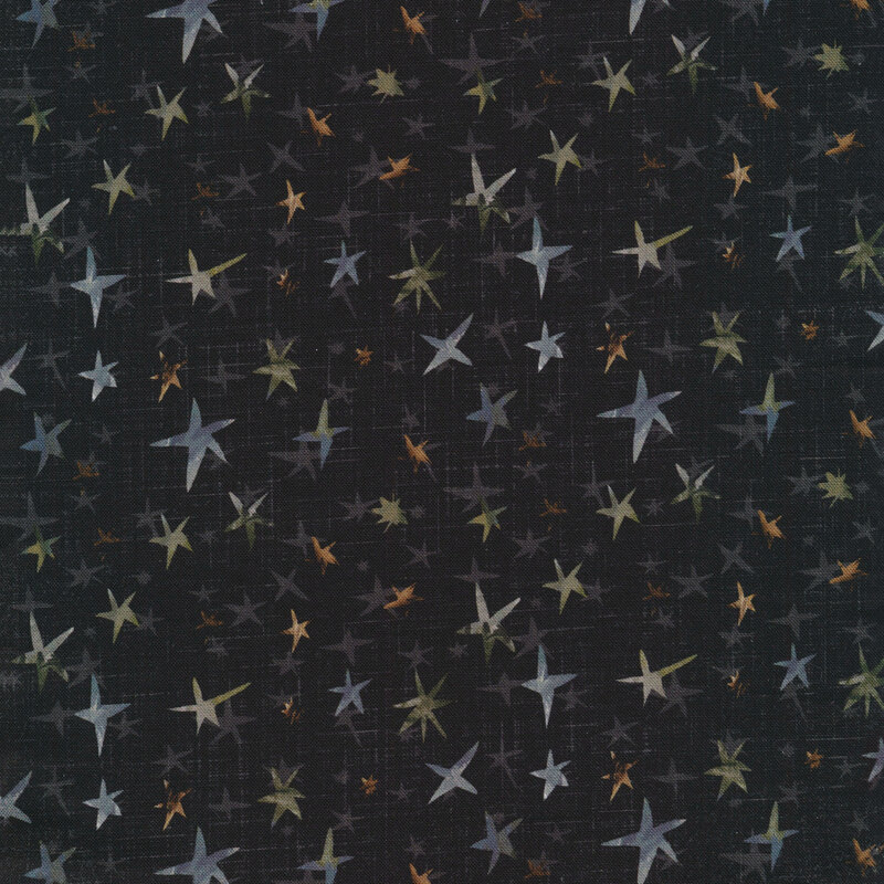 faded black textured fabric featuring scattered gray, blue, brown, and green stars