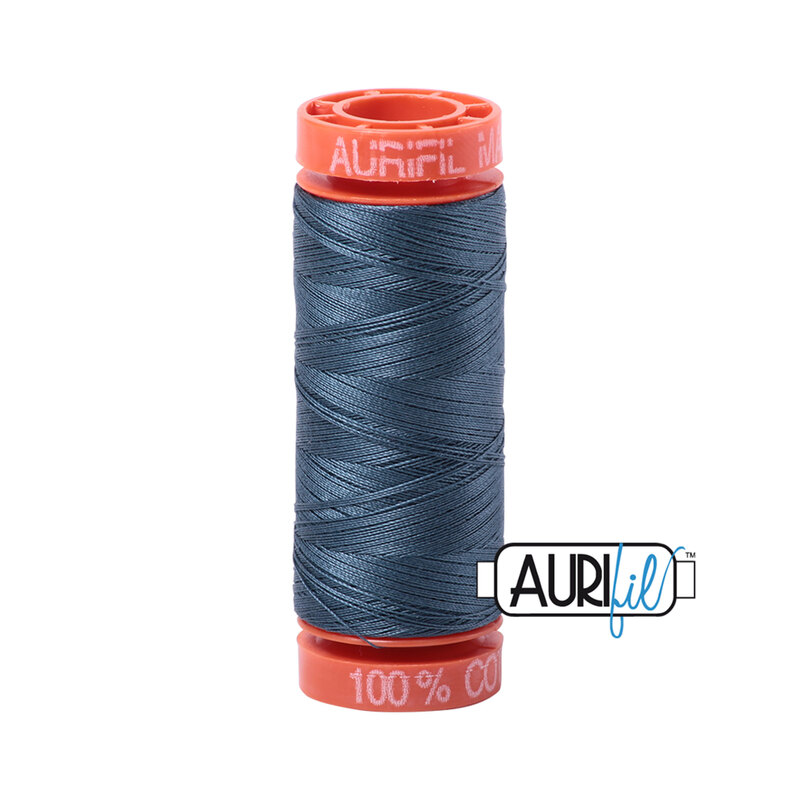 Medium Blue Gray thread on an orange spool, isolated on a white background