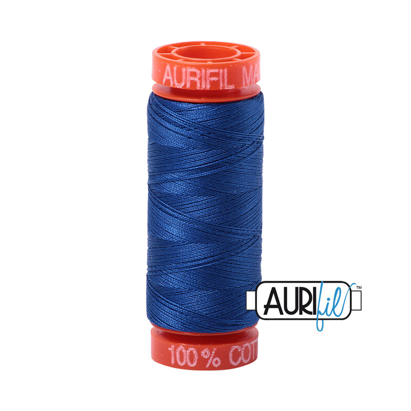 Medium Blue thread on an orange spool, isolated on a white background