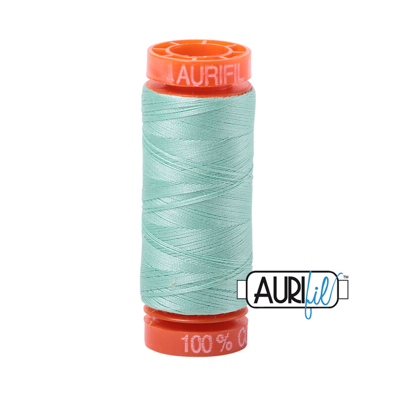 Medium Mint thread on an orange spool, isolated on a white background