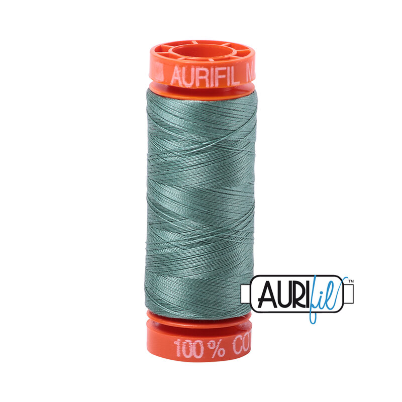 Medium Juniper thread on an orange spool, isolated on a white background