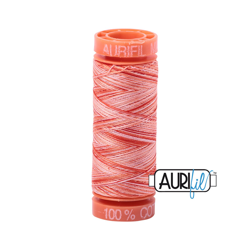 Mango Mist thread on an orange spool, isolated on a white background