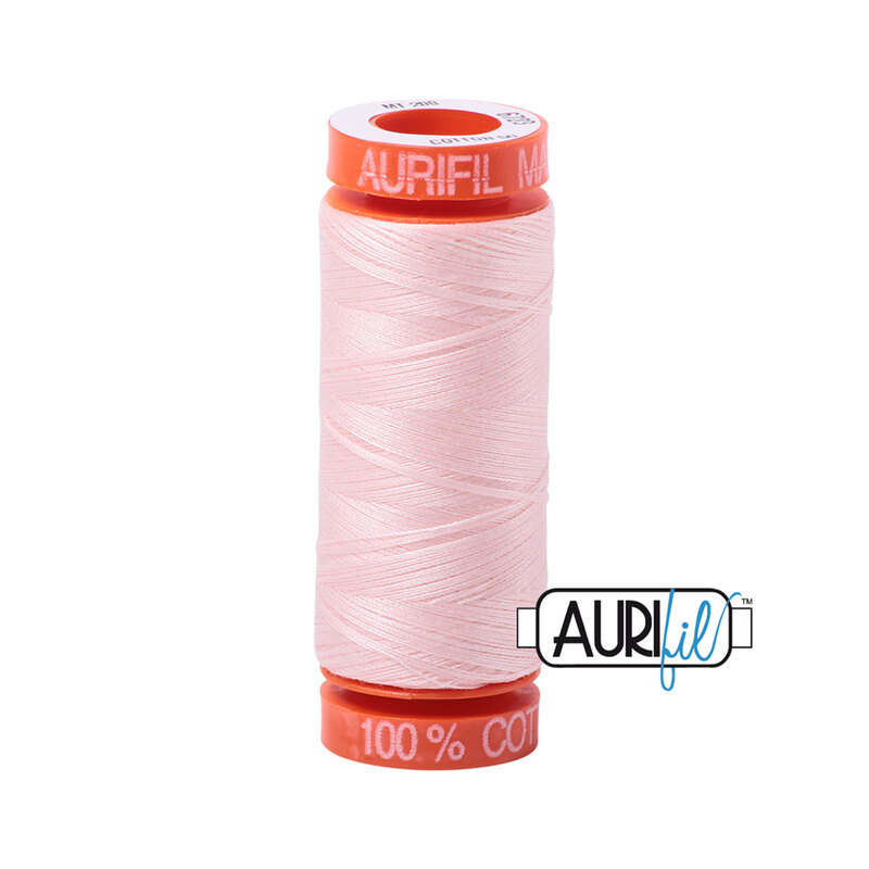 Fairy Floss thread on an orange spool, isolated on a white background