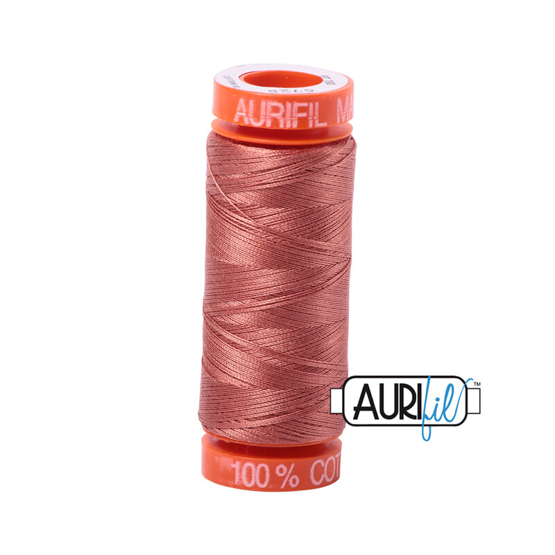 Cinnabar thread on an orange spool, isolated on a white background