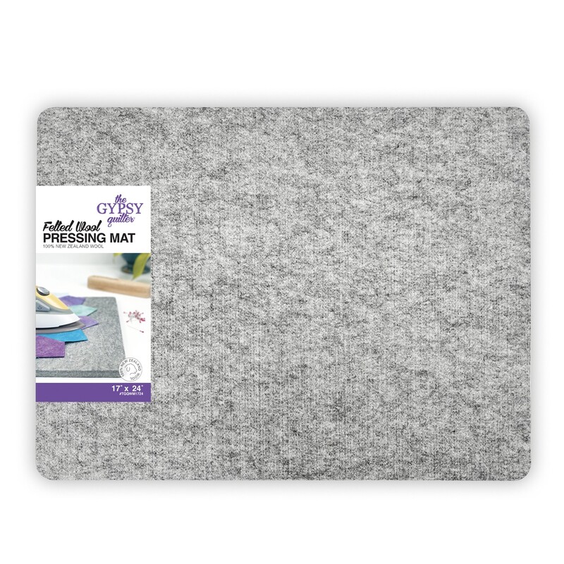 A gray wool pressing mat labeled 17” x 24” Pressing Mat with packaging graphics on the side