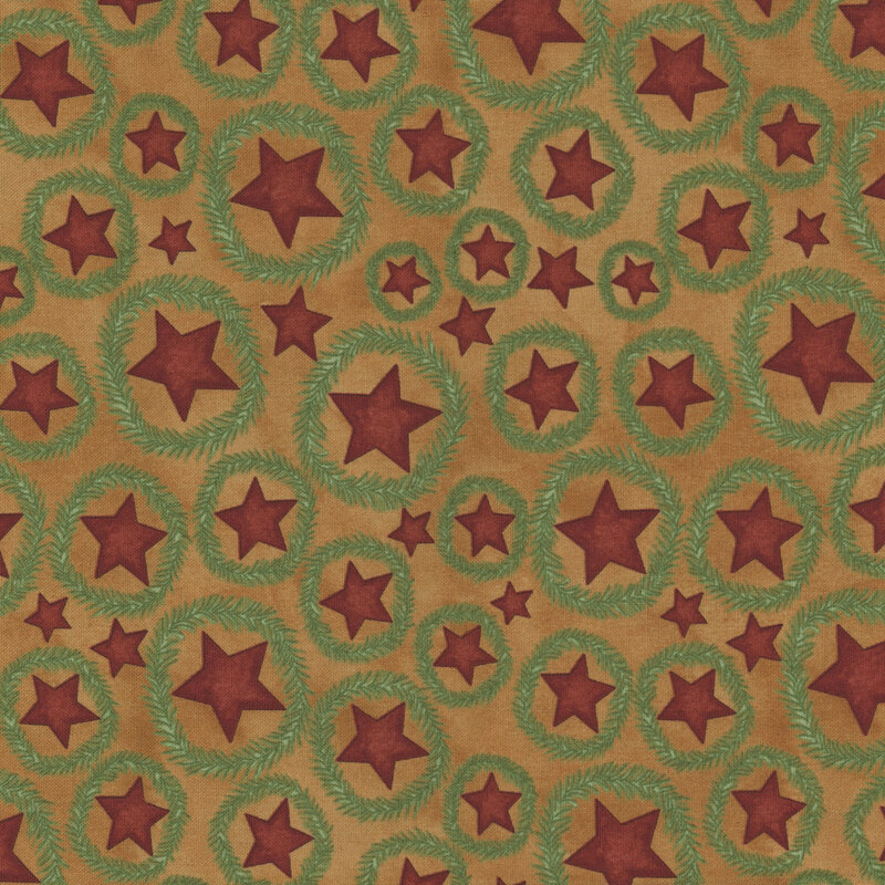 rich golden brown fabric featuring scattered red stars with fir wreaths surrounding them