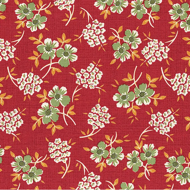 Red fabric with a floral pattern of green flowers and delicate white clusters of flowers