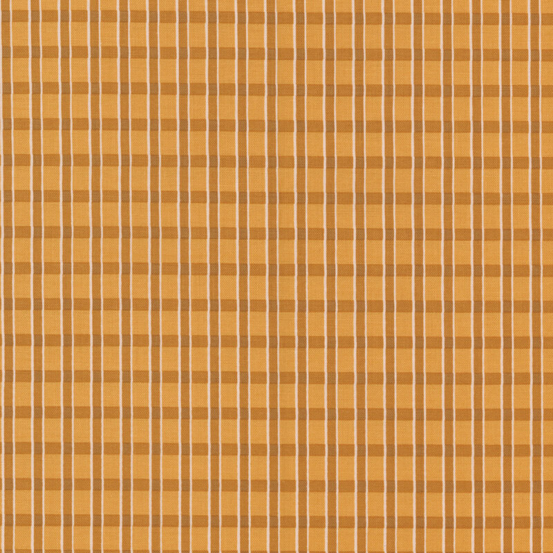 Golden fabric with a tonal plaid pattern