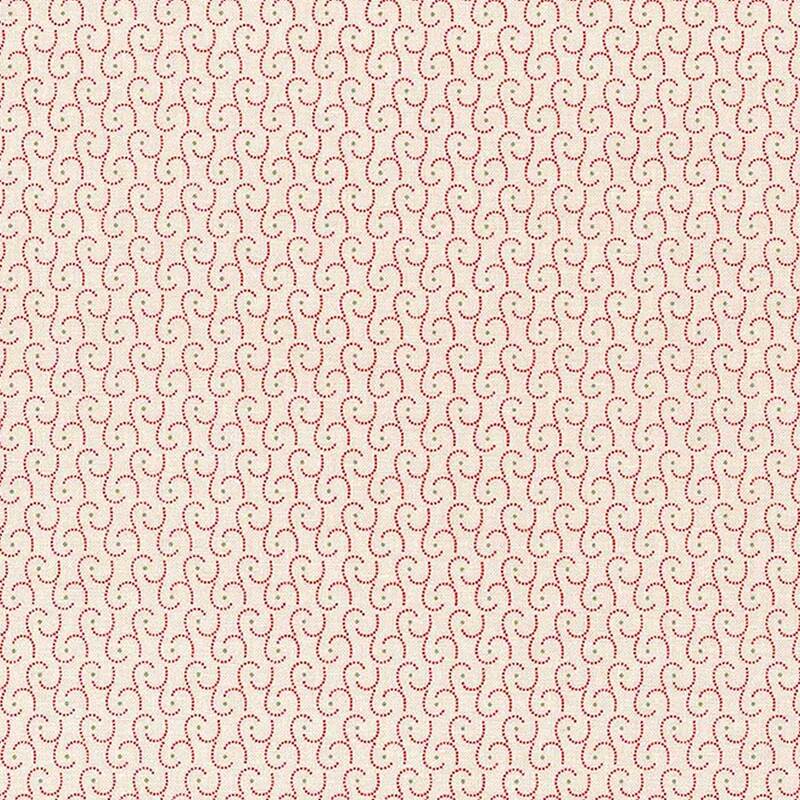 A quilt fabric with repetitive pattern of swirls in light pink and green on a cream background.