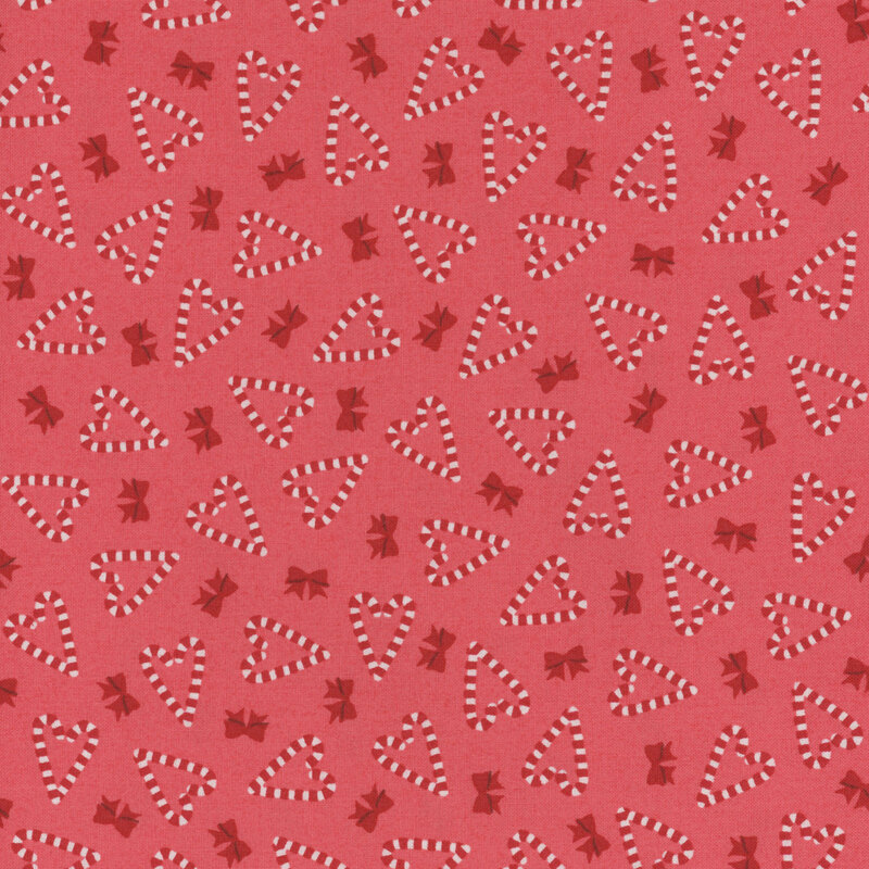 red fabric featuring heart shaped candy canes and bows