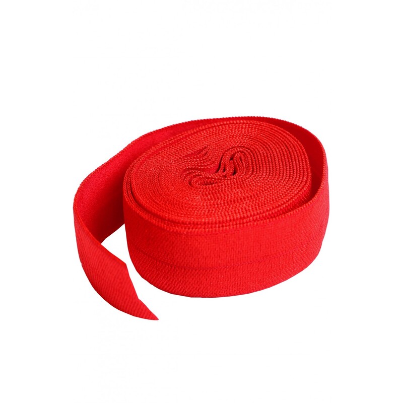 A roll of bright red elastic, 3/4