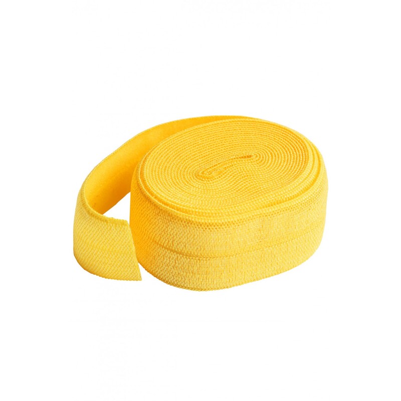 A circular roll of bright yellow elastic, 3/4